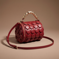 Lola Textured Leather Circular Barrel Crossbody Bag